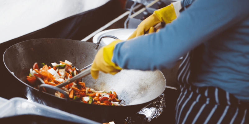 a chef cooking stir-fry