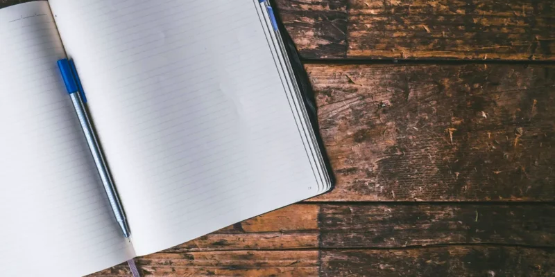 a photo of a journal on a wooden desk