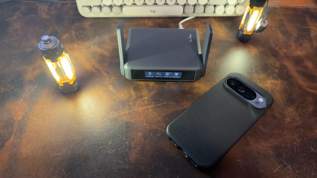 slate-7-size-comparison GL.iNet Slate 7 travel router next to a Google Pixel 10 Pro for size comparison