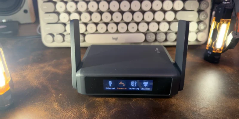 GL.iNet Slate 7 travel router showing touchscreen with Ethernet, Repeater, Tethering, and Cellular connection modes