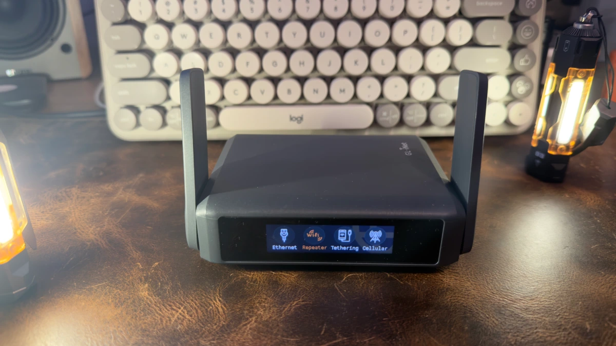 slate-7-travel-router-front GL.iNet Slate 7 travel router showing touchscreen with Ethernet, Repeater, Tethering, and Cellular connection modes