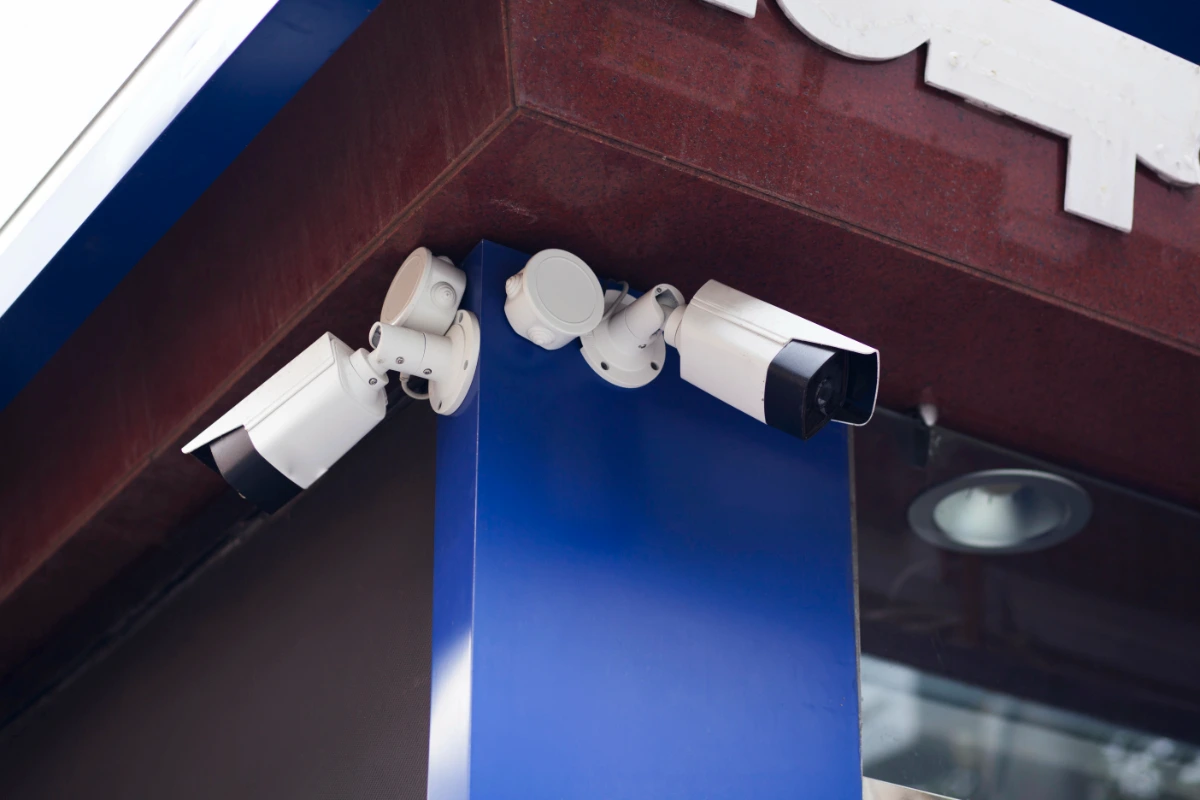 Multiple security cameras mounted on the corner of a building